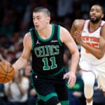 Boston Celtics guard Payton Pritchard (11) dribbles during game five of the NBA Eastern Conference semifinal against the New York Knicks at TD Garden.