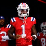 New England Patriots wide receiver Ja'Lynn Polk (1) runs onto the field to face the Houston Texans at Gillette Stadium.