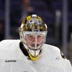 Boston Bruins goaltender Jeremy Swayman (1) reacts in the second period of an NHL hockey game against the New York Islanders, Wednesday, Nov. 26, 2025, in Elmont, N.Y.