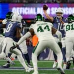 Drake Maye readies to throw a football to Stefon Diggs with multiple Jets defenders circling down the field.