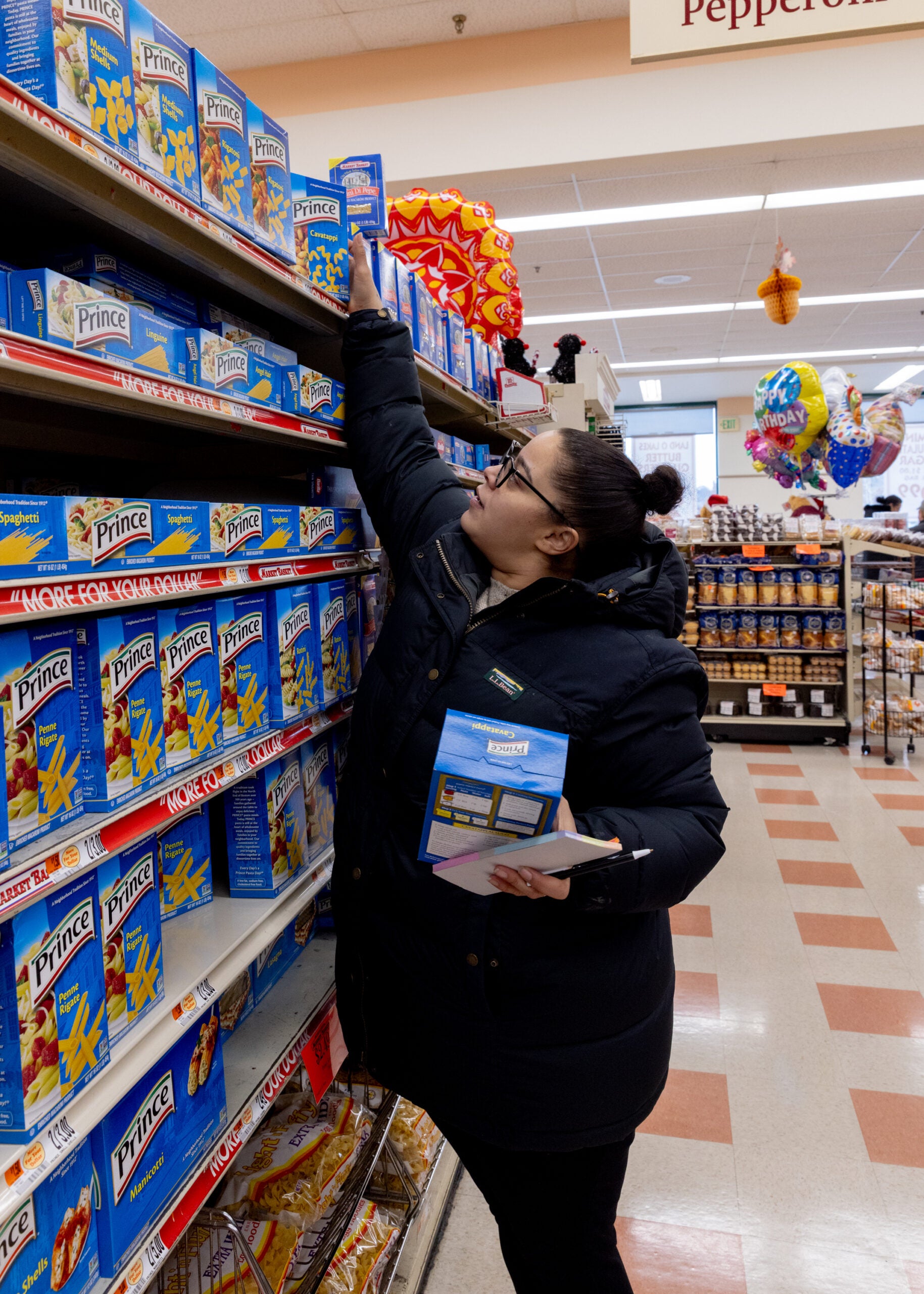 Leanna Nieves shops for groceries for Thanksgiving at a market in Haverhill, Mass.