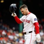 Boston Red Sox's Alex Bregman heads for the dugout after injuring himself on a single against the Baltimore Orioles during the fifth inning in the first baseball game of a doubleheader Friday, May 23, 2025, at Fenway Park in Boston.