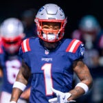 New England Patriots wide receiver Ja'Lynn Polk (1) runs onto the field before an NFL football game against the Miami Dolphins, Sunday, Nov. 24 2024, in Miami Gardens, Fla.