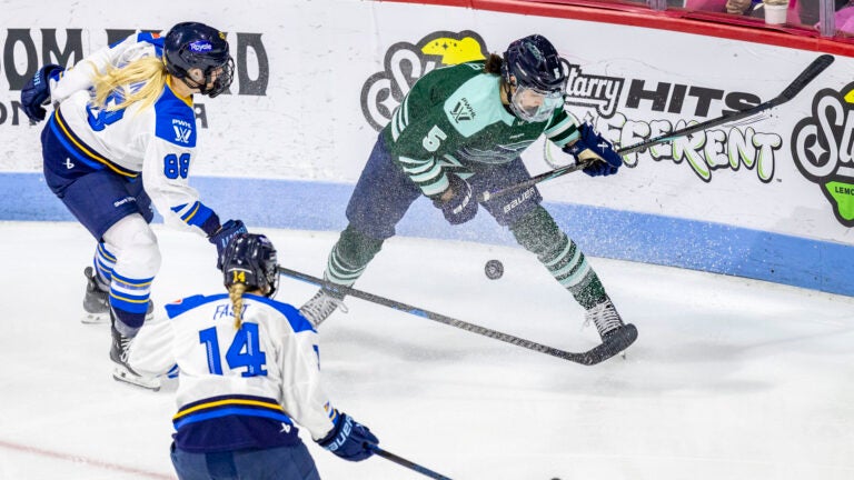 Toronto Sceptres forward Julia Gosling (88), Toronto Sceptres defense Renata Fast (14) and Boston Fleet defense Megan Keller (5) scramble for the puck during the game on Wednesday, March 26, 2025, at Agganis Arena. The Toronto Sceptres won 4 - 2.