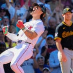 Jarren Duran #16 of the Boston Red Sox reacts at home plate after hitting a 3 run inside the park home run as Mitch Keller #23 starting pitcher of the Pittsburgh Pirates looks on during fifth inning MLB action at Fenway Park on Saturday August 30, 2025.
