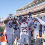New England Patriots cornerback Marcus Jones #25 celebrates his pick six with teammates against the Cincinnati Bengals during second quarter NFL action at Paycor Stadium on November 23, 2025.