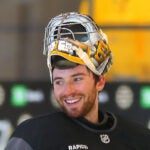 The Boston Bruins held a captain’s practice at Warrior Arena oin Thursday morning. Goalie Jeremy Swayman is all smiles at the endof practice.