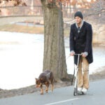 Brady, seen here walking his dog Lua in 2013, collected a blood sample to clone her into his new dog, Junie.